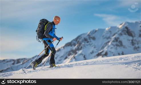 Uphill with skis and seal skins on the Alps