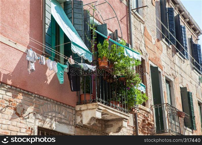 Upper circle or balcony represented in one of Venetian buildings in Italy. Beautiful and gorgeous traditional house.. Venetian buildings in Italy
