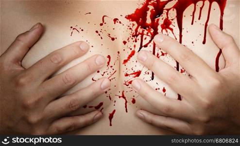 Upper part of female body, hands covering breasts - Blood