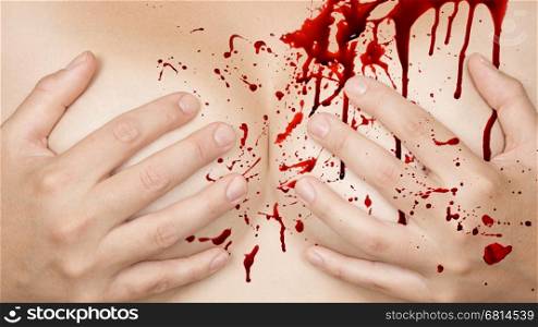 Upper part of female body, hands covering breasts - Blood