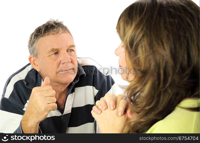 Upset and emotional middle aged couple after an argument.