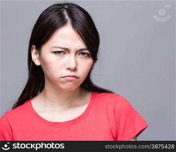 Upset Chinese woman scowling