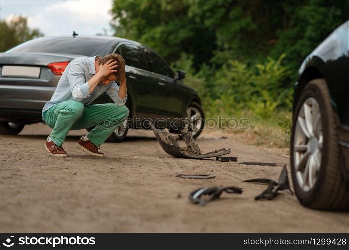 Upset male drivers after car accident on road. Automobile crash. Broken automobile or damaged vehicle, auto collision on highway. Upset male drivers after car accident on road