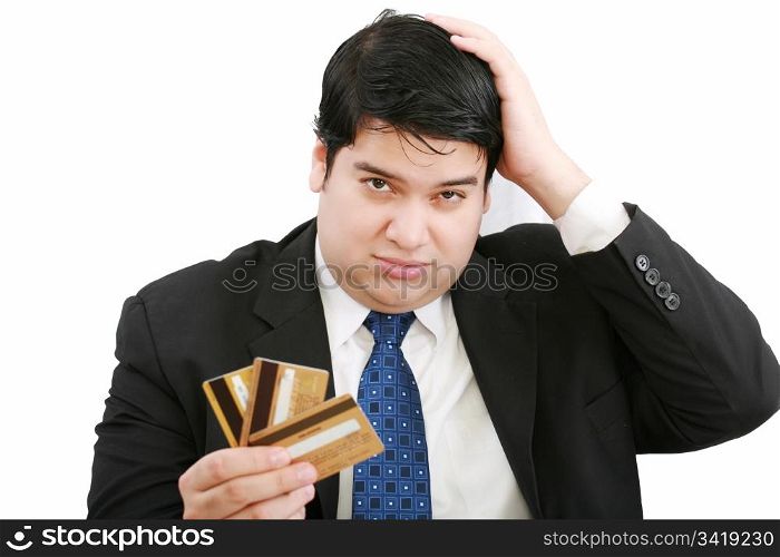 Upset robbed man glaring at his many credit cards.