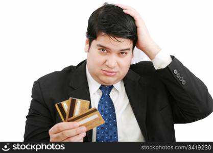 Upset robbed man glaring at his many credit cards.