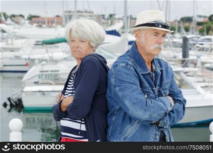 upset senior couple on holidays