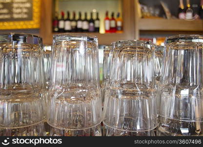 Upturned glasses at a pub counter