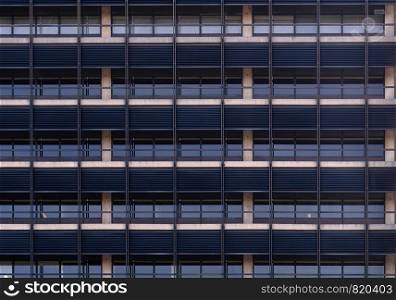 Urban abstract - window facade of business center office building with reflections and colours. Philadelphia PA USA