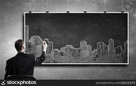 Urban architectural design. Rear view of businessman drawing construction project on banner