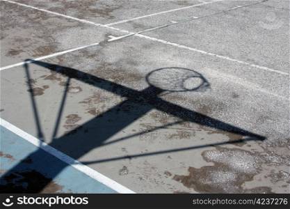 Urban basketball hoop shadow