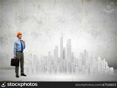Urban construction. Businessman looking at digital construction project of modern city