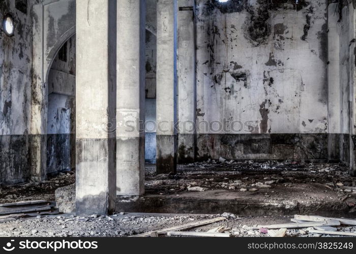 Urban decay, old gold smelting factory interior with pillars