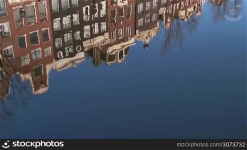 Urban landscape, city view of Amsterdam, The Netherlands, Holland, Europe. Traditional buildings, homes, houses, architecture and water canal