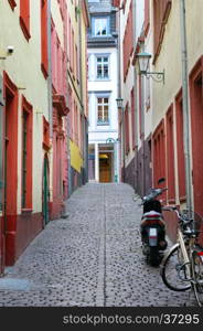 urban landscape with narrow streets, houses and cobbled pavements