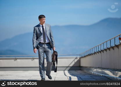 urban outdoor portrait of middle aged senior business man