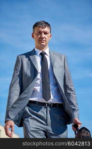 urban outdoor portrait of middle aged senior business man