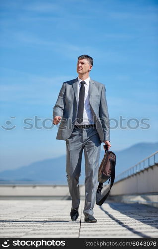 urban outdoor portrait of middle aged senior business man