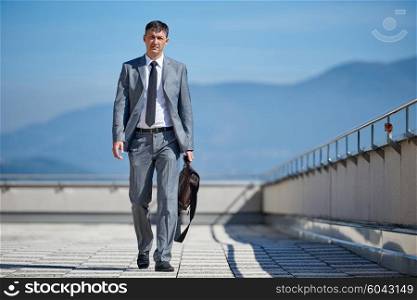 urban outdoor portrait of middle aged senior business man