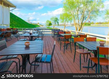 urban riverfront cafes and green trees