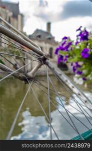 Urban scene, bicycle tied to the fence in Ghent, Belgium