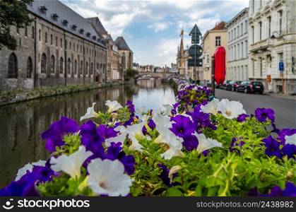 Urban scene, colorful flowers on the bridge in Ghent, Belgium