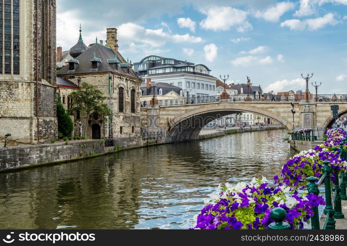 Urban scene, colorful flowers on the bridge in Ghent, Belgium