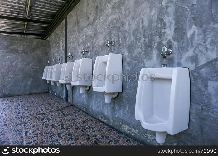 urinal row in a public restroom