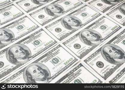 US dollar background. Closeup of a rows of banknotes hundred dollar bills. American currency