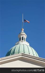 US flag flying at half mast on the saint loius courthouse