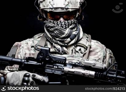 US Marine Corps soldier, army special forces fighter, modern combatant in camouflage uniform, battle helmet, tactical radio headset, face hidden behind shemagh, looking in camera, portrait on black. Armed marine rider portrait with hidden face