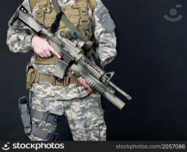 US soldier holding his assault rifle