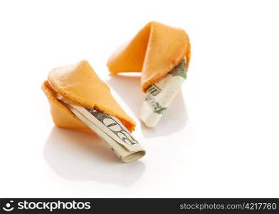 US twenty dollar bills inside Chinese fortune cookies. Metaphor for American debt to China. Isolated.