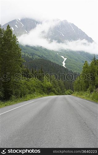 USA, Alaska, empty road in mountains