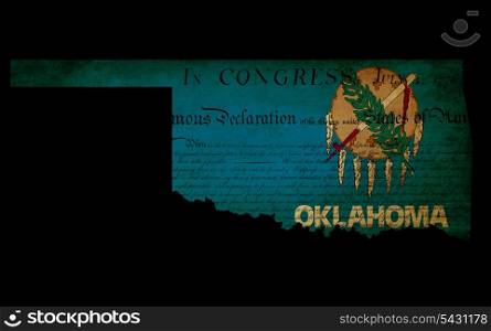 USA American Oklahoma state map outline with grunge effect flag insert and Declaration of Independence overlay
