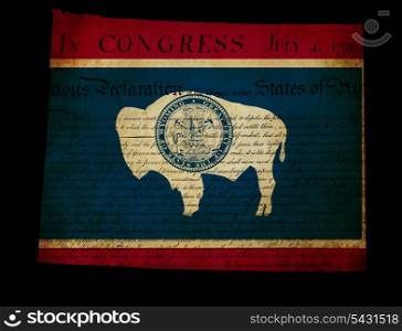 USA American Wyoming state map outline with grunge effect flag insert and Declaration of Independence overlay