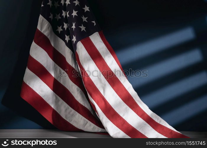 USA Flag Hanging on the Wall. American Symbolic. 4th of July or Memorial Day of United States. Morning Sunlight through the Window