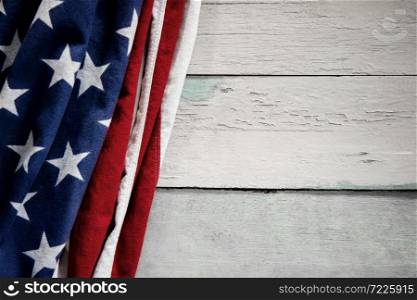 USA Flag Lying on Vintage Weathered Wooden Background. American Symbolic. 4th of July or Memorial Day of United States. Copy Space for Text
