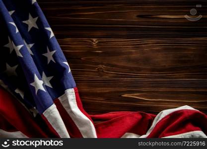 USA Flag Lying on Wooden Background. American Symbolic. 4th of July or Memorial Day of United States. Copy Space for Text