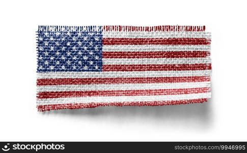 USA flag on a piece of cloth on a white background.. USA flag on a piece of cloth on a white background