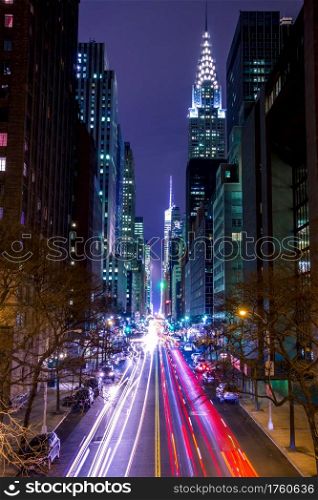 USA, New York City. Manhattan. Night 42 st. High buildings, street lights and car headlights. Night Traffic on 42nd Street of New York City