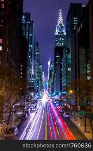 USA, New York City. Manhattan. Night 42 st. High buildings, street lights and car headlights. Night Traffic on 42nd Street of New York City