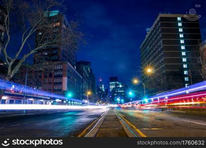 USA, New York City. Manhattan night street and tracks from car headlights. Night Street and Tracks from Car Headlights