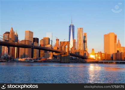USA. New York. The skyscrapers of Manhattan and the Brooklyn bridge. Morning. Morning over Manhattan