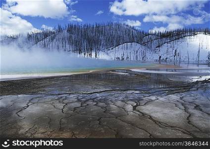 USA, Wyoming, Yellowstone National Park, Grand Prismatic Spring, mist over hot spring in winter landscape