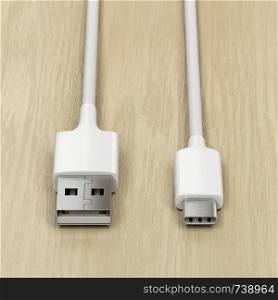 USB-A and USB-C cables on wood background