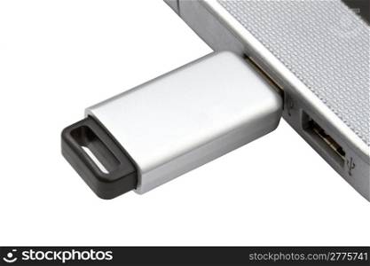 USB Flash Drive and laptop isolated on white