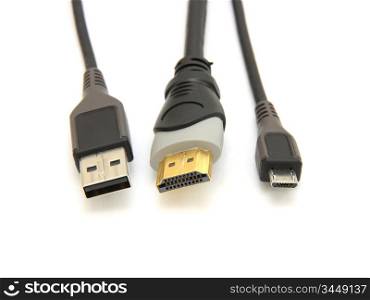 usb plug and large and small hdmi cable on white background