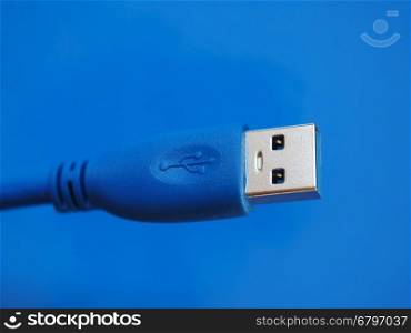 USB plug over blue. USB plug for computer over blue background