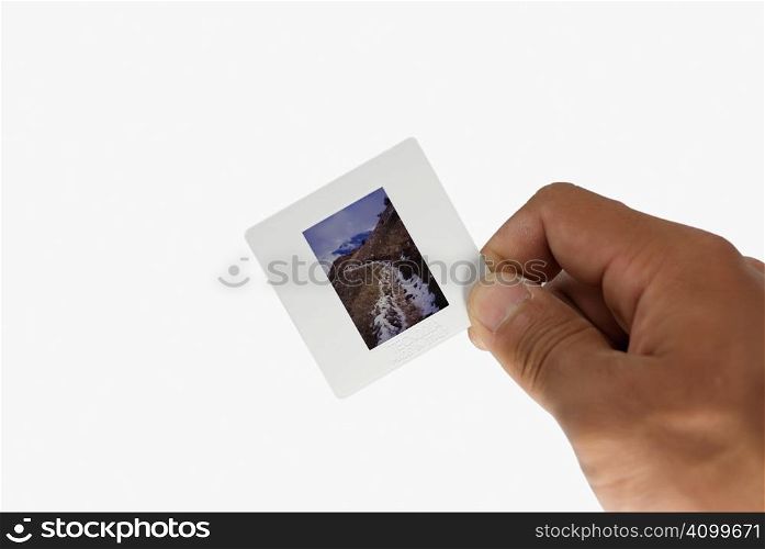 Use one&acute;s hand to hold a clip of film. It&acute;s positive.