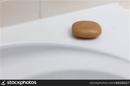 Used brown soap in a bathroom, hygiene
